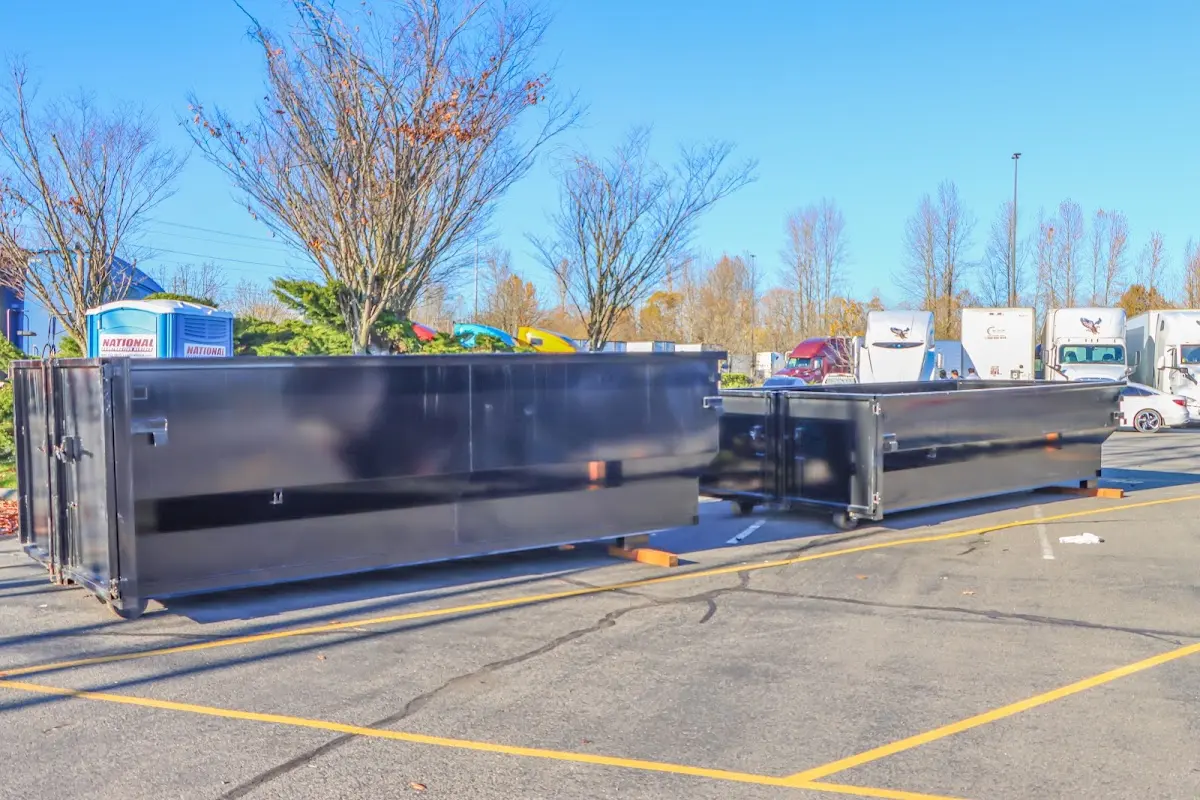 Professional dumpster rental service with roll-off container on residential driveway in Los Gatos